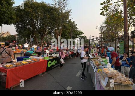 Sunday night market along Nan's Kuang Mueng Nan Walking Street, located just in front of the city`s cultural heart and famous temple, Wat Phumin. Stock Photo